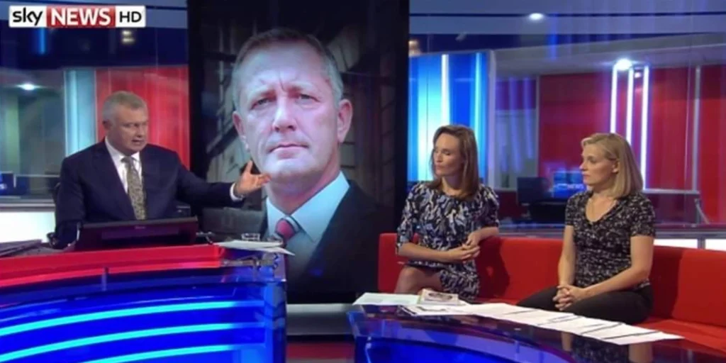 Chris Tuck sitting on a sofa at Sky News talking to Eamon Holmes
