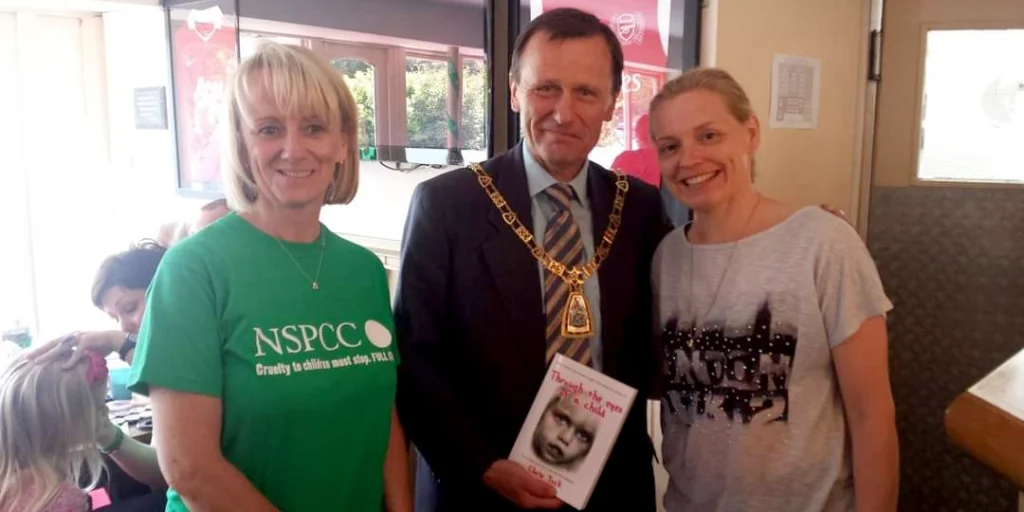Bromley Mayor with Author Chris Tuck holding her book Through the eyes of a child