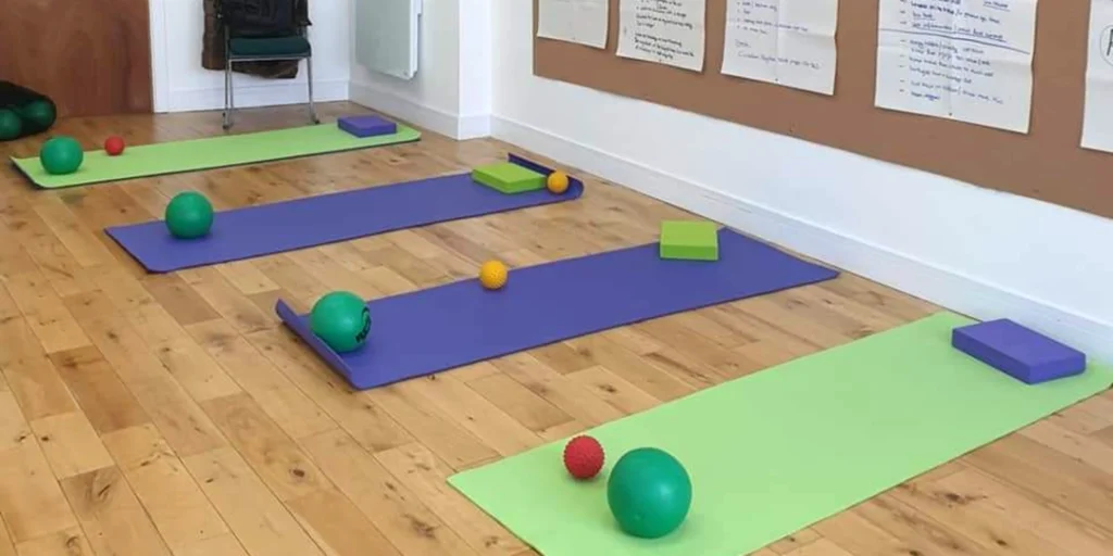 Pilates mats and equipment on the floor for Chris Tuck's training programmes